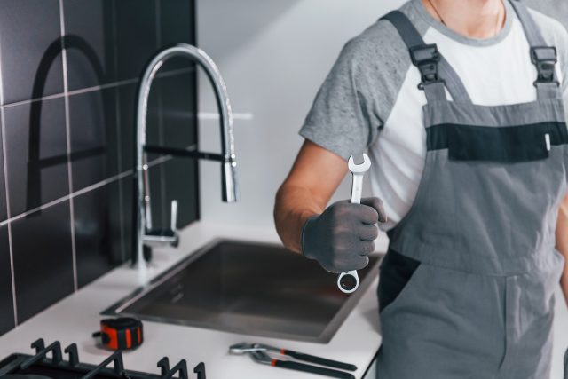 Plumbers in working on Blocked sink or Dishwasher